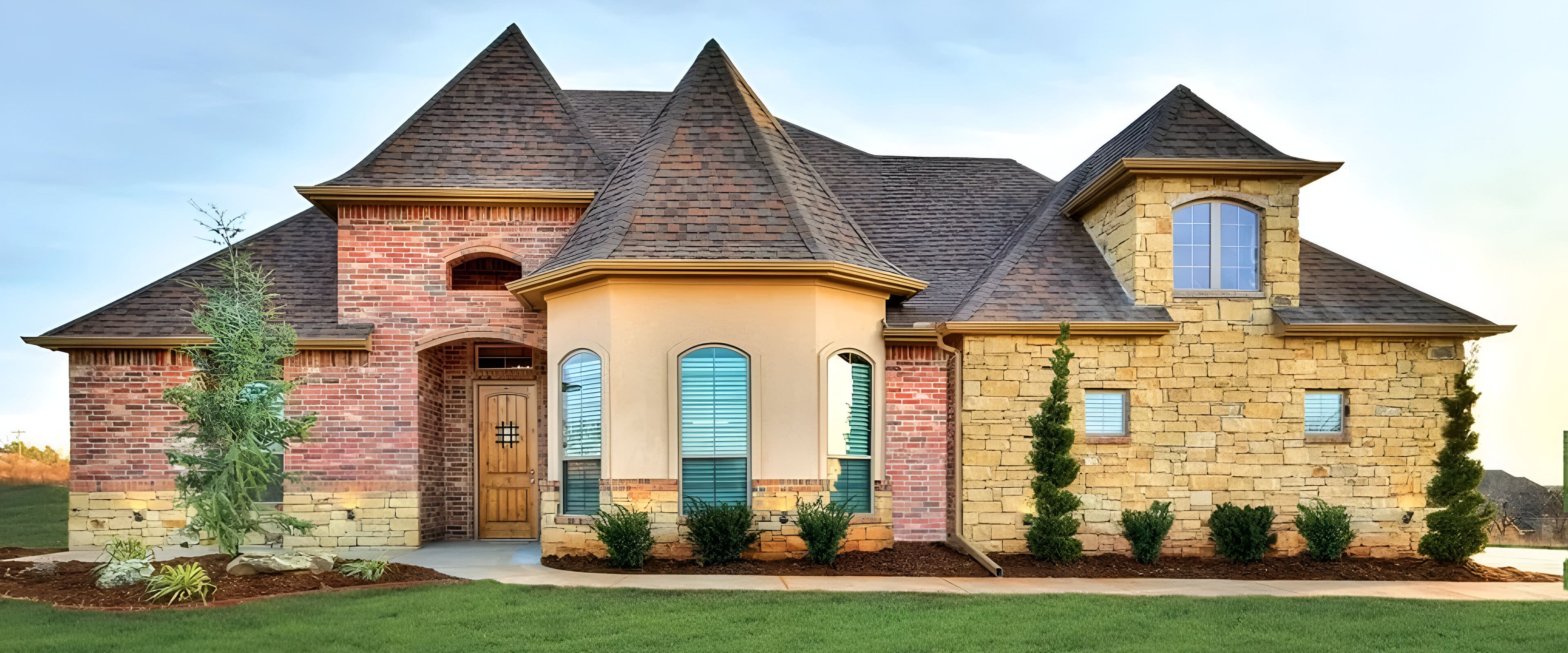 Brick and stone house with turrets.